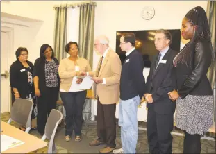  ??  ?? Margarita Rhoden, far left, board member, Janaya Thompson, treasurer, Amanda Stewart, ex-officio and Charles County Commission­er, Sam Worsley, Andrew Pizor, vice president, William Wise, board member, and Claudia Bellony-Atanga, board president,...