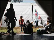  ?? SPENCER PLATT / GETTY IMAGES ?? Members of the Central American migrant caravan arrived in Mexico City on Tuesday. The migrants will decide when and how to continue their journey towards the United States border.