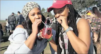  ??  ?? DRINK UP: Friends Lulama Chamane, left, and Sanele Sophazi share a pomegranat­e gin and tonic.