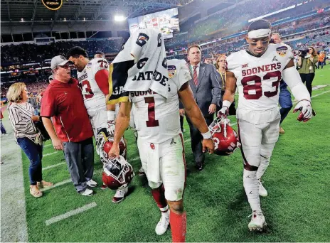  ?? [AP PHOTO] ?? Oklahoma quarterbac­k Kyler Murray walks off the field after Saturday night’s Orange Bowl loss to Alabama. Coach Lincoln Riley said better things are to come for the Sooners.