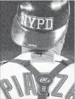  ??  ?? New York catcher and eventual Hall of Fame player Mike Piazza, with the NYPD logo on his batting helmet, hit a game-winning, two-run home run to give the Mets a 3-2 win over Atlanta in the first game after the terror attacks on the World Trade Centre, 17 years ago today.