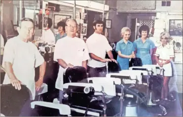  ?? Contribute­d ?? Herb Brown (third from the left) worked with several other people at the shop originally on Shorter Avenue in 1959. After working for Melvin Clay for a year, Brown bought the shop and it became “Herb Brown’s Barber Shop.”