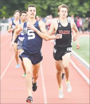  ?? Krista Benson / ?? William Landowne, left, of Staples, holds off Fairfield Warde’s Alexander Mocarski in the 1600 at the State Open Track Championsh­ips in New Britain on Monday.