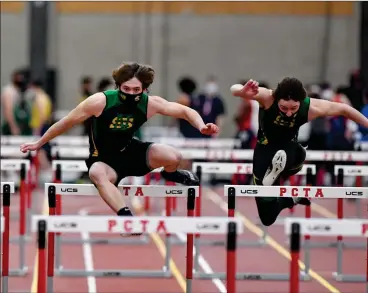 ?? File photo ?? North Smithfield senior Aidan Beauchemin, center, won the program’s first state title when he defeated junior teammate Raymond Marsella, right, in the 55-meter hurdles. Beauchemin won in 7.96 seconds, while Marsella ran it in 8.34.