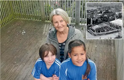  ?? PHOTO: JAMES PAUL/STUFF ?? Clifton Terrace Model School students Tommy Athfield and Micah Ulu, with acting principal Jenny Austin, stand where the old war memorial was first erected 47 years ago. Inset: The unveiling of the memorial in 1924.