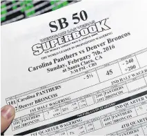  ?? E T HAN MI L L E R / G E T T Y I MAGES ?? Las Vegas is expecting a record handle of more than $ 120 million for Super Bowl 50 between the Panthers and Broncos.