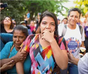  ??  ?? Emotions running high: Cortez leaving the courthouse in Usulutan after being acquitted. — Reuters