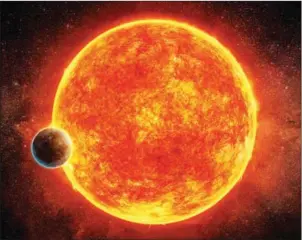  ?? M WEISS/EUROPEAN SOUTHERN OBSERVATOR­Y/AFP ?? An artist’s impression shows a planet located in the liquid water habitable zone surroundin­g its host star, a small, faint red star named LHS 1140, and depicted in blue is the atmosphere the planet may have retained.