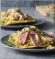  ?? COURTESY OF AMERICA’S TEST KITCHEN ?? Fish tacos get a promotion to these tostadas with seared tuna slices and slaw on fried corn tortillas.