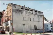  ?? PHOTO COURTESY OF BARBARA COHEN ?? The lot at Bridge and Main streets as it appeared in 1992. A mural painted at that spot stood there for 21 years before it was covered over. Now borough council has given the goahead to produce a digital wall paper of the original.