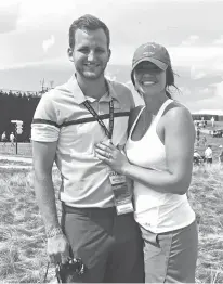  ?? Associated Press ?? Malea Blise poses on June 17 with her engagement ring after Nick Rogness proposed to her during the third round of the U.S. Open golf tournament at Erin Hills in Erin, Wis.