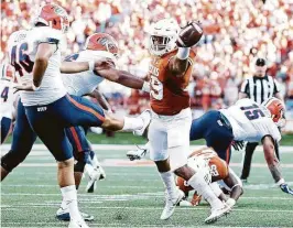  ?? Tom Reel / San Antonio Express-News ?? UT freshman defensive back Brandon Jones blocks the punt of Alan Luna in the first half, setting up a field goal for the Longhorns in Texas’ victory in Austin.