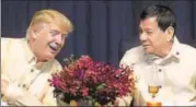  ?? AFP ?? Donald Trump and Rodrigo Duterte in conversati­on at a celebratio­n dinner for the Asean Summit in Manila on Sunday.