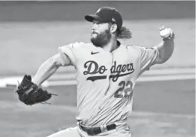  ?? KEVIN JAIRAJ/USA TODAY SPORTS ?? Dodgers starting pitcher Clayton Kershaw throws against the Rays during Game 5 of last season’s World Series on Oct. 25.