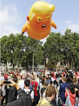  ??  ?? Hot air: The Trump inflatable in London yesterday