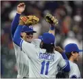  ?? DAVID J. PHILLIP — THE ASSOCIATED PRESS ?? Bobby Witt Jr., left, and Maikel Garcia celebrate the Royals’ 3-2victory over the Astros on Saturday night.