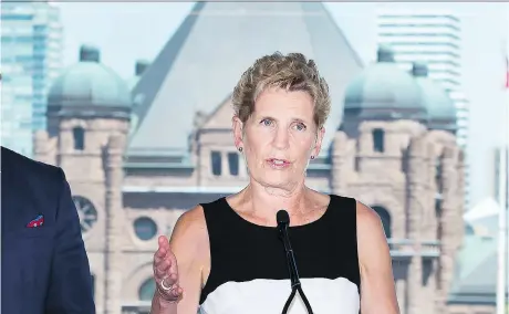  ?? NATHAN DENETTE/THE CANADIAN PRESS ?? Ontario Liberal Leader Kathleen Wynne speaks to the media while making a campaign stop in Toronto on Monday.