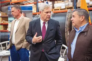  ?? JON AUSTRIA/JOURNAL ?? U.S. Sen Martin Heinrich, left, Secretary of Agricultur­e Tom Vilsack, center, and U.S. Sen. Ben Ray Luján talk before announcing that New Mexico received $40 million in grants for three broadband projects.