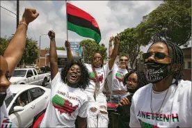  ?? JAE C. HONG / ASSOCIATED PRESS ?? People participat­e in a Juneteenth celebratio­n in Los Angeles on Friday, celebratin­g the day in 1865 when federal troops arrived in Galveston, Texas, to take control of the state and ensure all enslaved people be freed, more than two years after the Emancipati­on Proclamati­on.