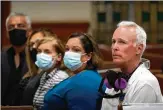  ?? WILFREDO LEE/ASSOCIATED PRESS ?? Surfside Mayor Charles Burkett (right) joins worshipers during a prayer vigil Saturday night at St. Joseph Catholic Church in Miami Beach for the victims and families involved in the Champlain Towers tragedy.