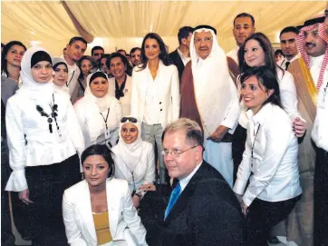  ??  ?? Clockwise from main image: John greets Nelson Mandela; with Joan Collins, with Queen Rania of Jordan, and with the cast of Twelfth Night.