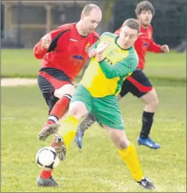  ?? Picture: Chris Davey FM2447287 Buy this picture from kentonline.co.uk ?? TOP TACKLE: Charing win back possession against Herne Bay Athletic (red)