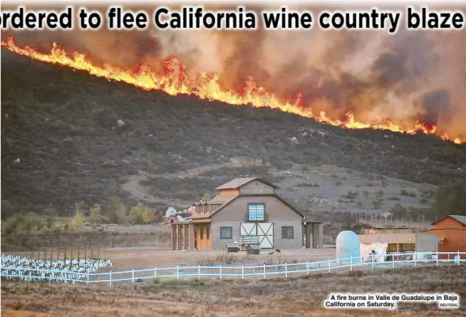  ?? REUTERS ?? A fire burns in Valle de Guadalupe in Baja California on Saturday.