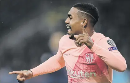  ?? Picture: AFP ?? IN THE NET. Barcelona’s Malcom celebrates after opening the scoring during their Champions League match against Inter Milan at the San Siro on Tuesday night. The game ended 1-1.