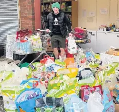  ??  ?? Christmas cheer Donations to Coatbridge foodbank by residents of Parklands Estate