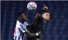  ?? Photograph: Quality Sport Images/Getty ?? Zaidu Sanusi of Porto competes for the ball with Manchester City’s Phil Foden.
