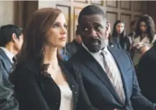  ?? Michael Gibson, STX Entertainm­ent ?? Jessica Chastain and Idris Elba in “Molly’s Game.”