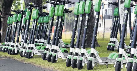  ?? PHOTO: PETER MCINTOSH ?? All lined up . . . Lime scooters at Logan Park.