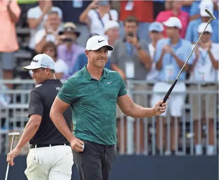  ?? JOHN DAVID MERCER/USA TODAY SPORTS ?? Brooks Koepka celebrates on the 18th green after winning the PGA Championsh­ip at Bellerive Country Club on Sunday. In June, he won the U.S. Open.