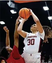  ?? ?? Stanford guard Haley Jones (30) shoots against Sacred Heart guard Ny’Ceara Pryor during the first half on Friday.