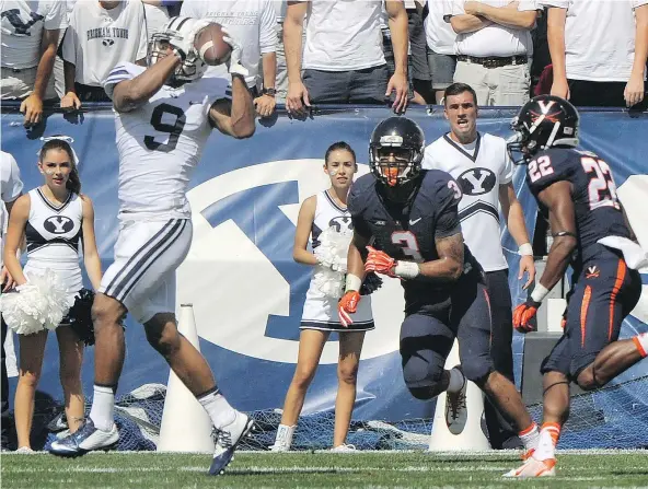  ?? — GETTY IMAGES FILES ?? Quin Blanding, centre, is one of the best safeties in college football playing on a rebuilding Virginia squad.