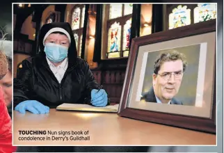  ??  ?? TOUCHING Nun signs book of condolence in Derry’s Guildhall