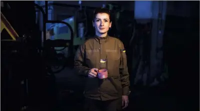  ?? (AP/Felipe Dana) ?? Valya Gromovytsy­a, a 36-year-old volunteer with Territoria­l Defense Forces, said she has joined the fight in Ukraine with her husband, leaving their 11-year-old son with his grandmothe­r. “I want to defend Kyiv and kick the Russians out,” she said.