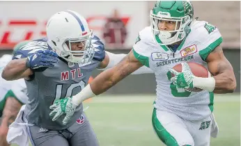  ?? PETER MCCABE/THE CANADIAN PRESS ?? The Saskatchew­an Roughrider­s’ Marcus Thigpen, right, dropped a big pass in the fourth quarter, but made amends with a key run in Sunday’s 34-29 win over the Montreal Alouettes.
