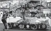  ??  ?? Kevin Harvick celebrates after winning the NASCAR Brickyard 400 auto race at Indianapol­is Motor Speedway on Sunday in Indianapol­is. [AP PHOTO/ROB BAKER]