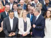  ?? — AFP ?? Newly elected group president Richard Ferrand (2nd R) jokes with MP Barbara Pompili as they attend a group picture of the La Republique En Marche (REM) party’s newly elected members of parliament during a two-day working seminary at the French National...