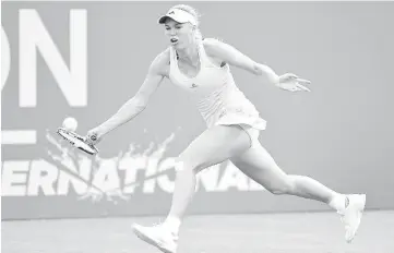  ??  ?? Denmark’s Caroline Wozniacki returns the ball to Australia’s Jarmila Gajdosova during their women’s singles second round match at the WTA Eastbourne Internatio­nal tennis tournament in Eastbourne, southern England. - AFP photo