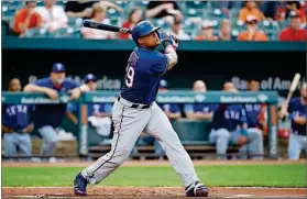  ?? PATRICK SEMANSKY / THE ASSOCIATED PRESS ?? The Rangers’ Adrian Beltre watches his RBI single in the first inning Thursday against the OriolesinB altimore.