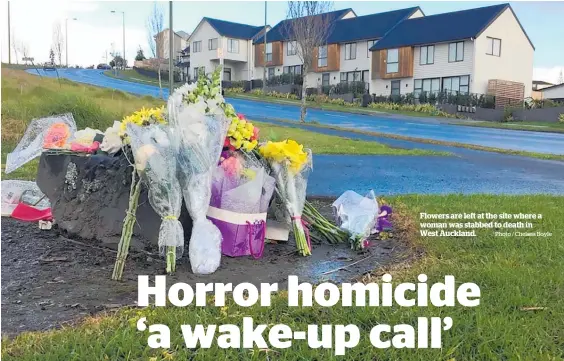  ?? Photo / Chelsea Boyle ?? Flowers are left at the site where a woman was stabbed to death in West Auckland.