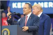  ?? SUSAN WALSH/ASSOCIATED PRESS ?? President Donald Trump, right, listens as Kentucky Gov. Matt Bevin, left, speaks during a campaign rally in Lexington, Ky., Monday.