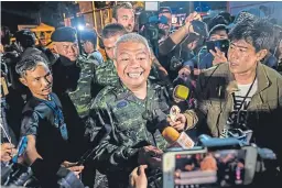  ?? Pictures: Getty Images/AP. ?? Left: Footage showing the boys inside the cave. Above: General Bancha Duriyaphan speaks to the press after the 12 boys and their football coach were found. Top: Relatives of the trapped boys.