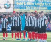  ?? ?? Remy Clerima (second left) and his teammates observe the minute’s silence for Remembranc­e Day.