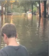  ?? EVAN BRANDT PHOTOS — MEDIANEWS GROUP ?? Right: Floodwater­s from Manatawny Creek fill Walnut Street as the sun set Tuesday. The homes were evacuated overnight. Below: Harmonyvil­le Road in South Coventry was partially blocked by a fallen tree Wednesday.