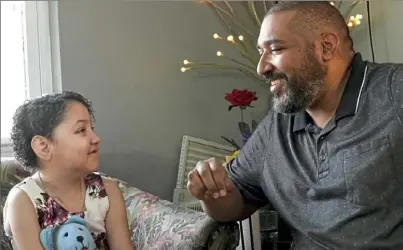  ?? Matt Freed/Post-Gazette ?? Kendra Acosta, 10, sits with her father, Roger, on Friday in Penn Hills. Kendra received a multi-organ transplant in February.