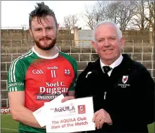  ??  ?? Johnny Brosnan, East Kerry Board Chairman, presenting the Aquila Club Man of the Match award to Kilcummin’s Gary O’Leary