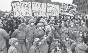  ?? FRANK BECERRA JR./USA TODAY NETWORK ?? Emergency service workers from Westcheste­r County, N.Y., display solidarity and support for front-line workers April 14.